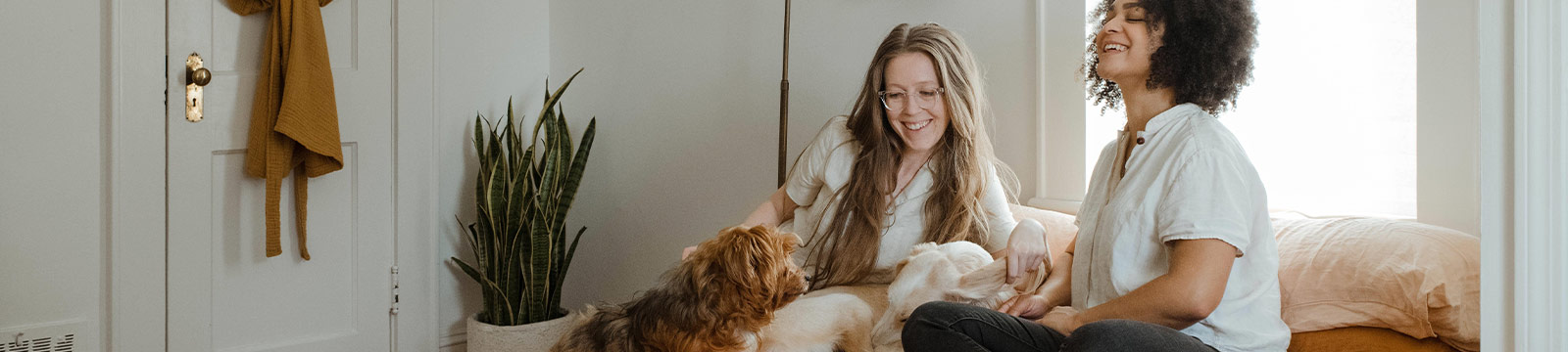 Two women and their dog.