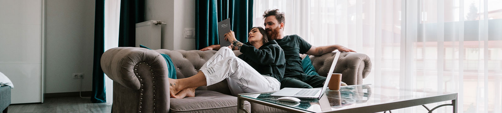 Couple lounging on the couch.