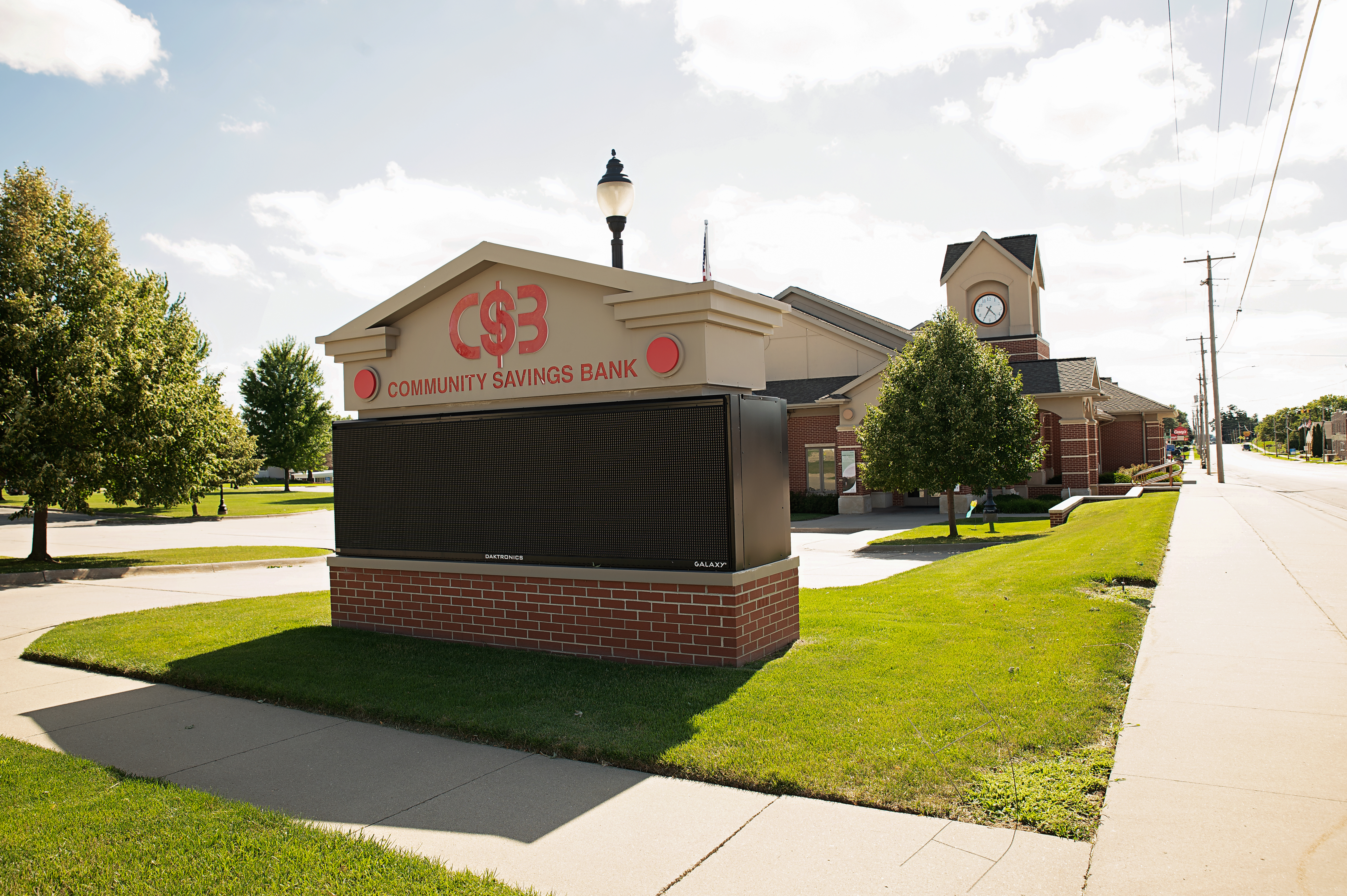 Outside of Community Savings Bank branch on a sunny day.
