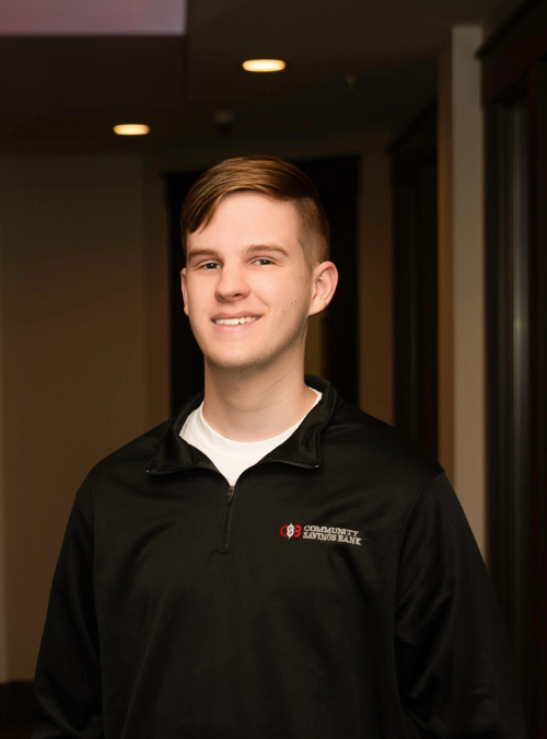 A headshot of a man wearing a Community Savings Bank quarter zip.